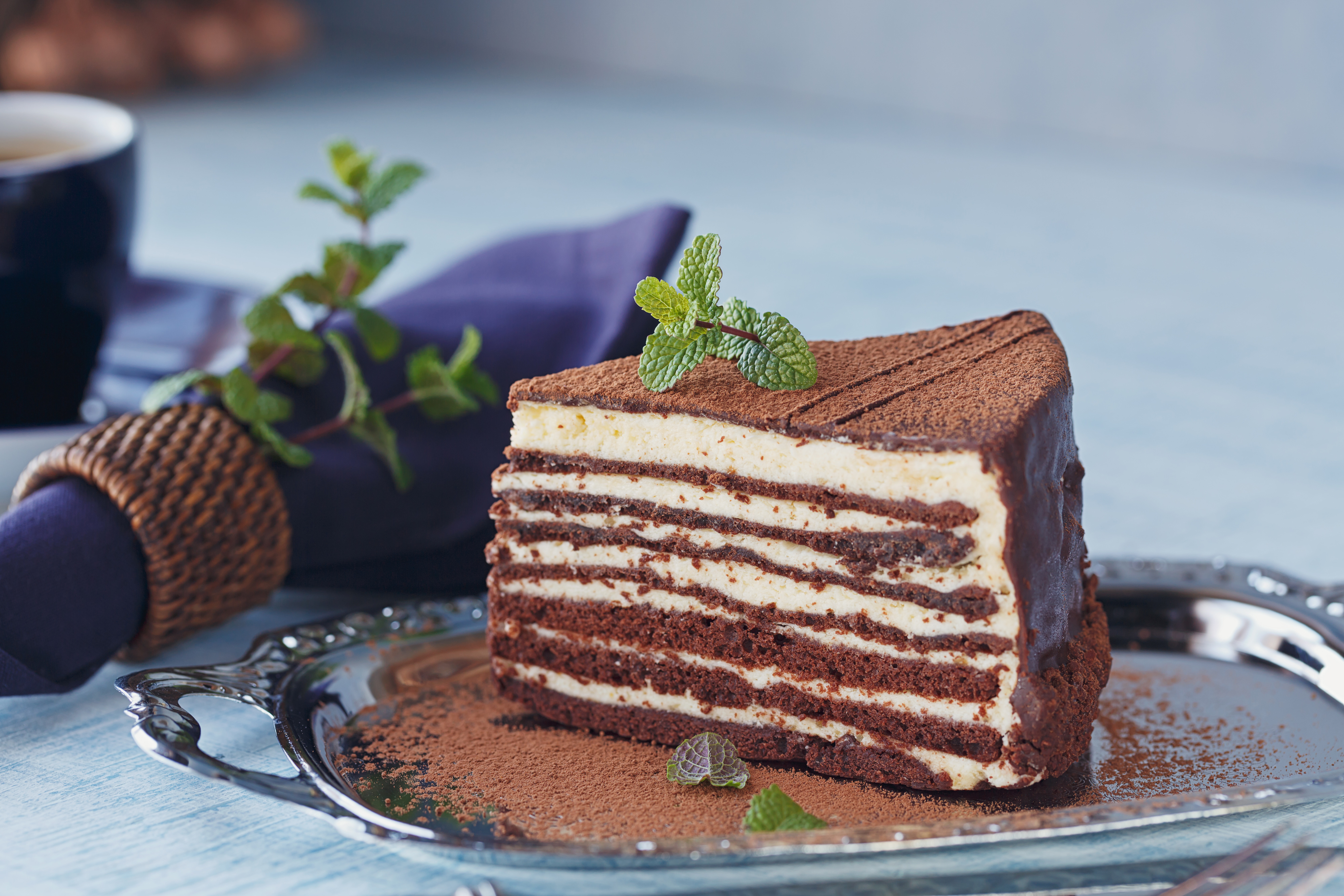 Slice of delicious chocolate cake on silver plate Slice of delicious chocolate cake on silver plate